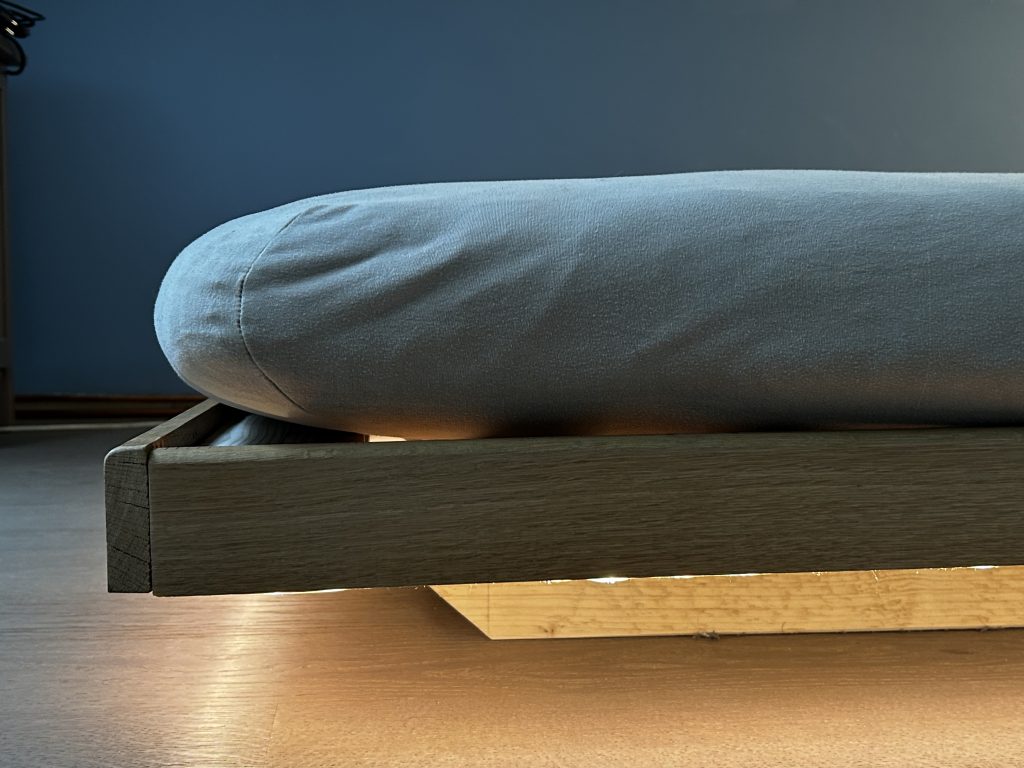 Handmade wooden futon bed frame with low platform design
